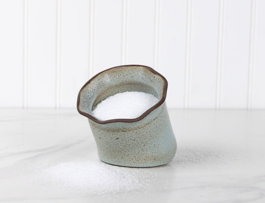 Ceramic vase with a textured surface on a white background